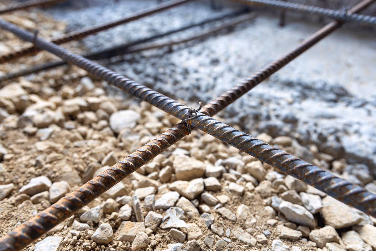American Highway’s welded wire mesh installed in warehouse concrete flatwork, reinforcing slabs for high-traffic durability. Close-up of epoxy-coated welded wire mesh in industrial flatwork, ensuring crack-free concrete stability.