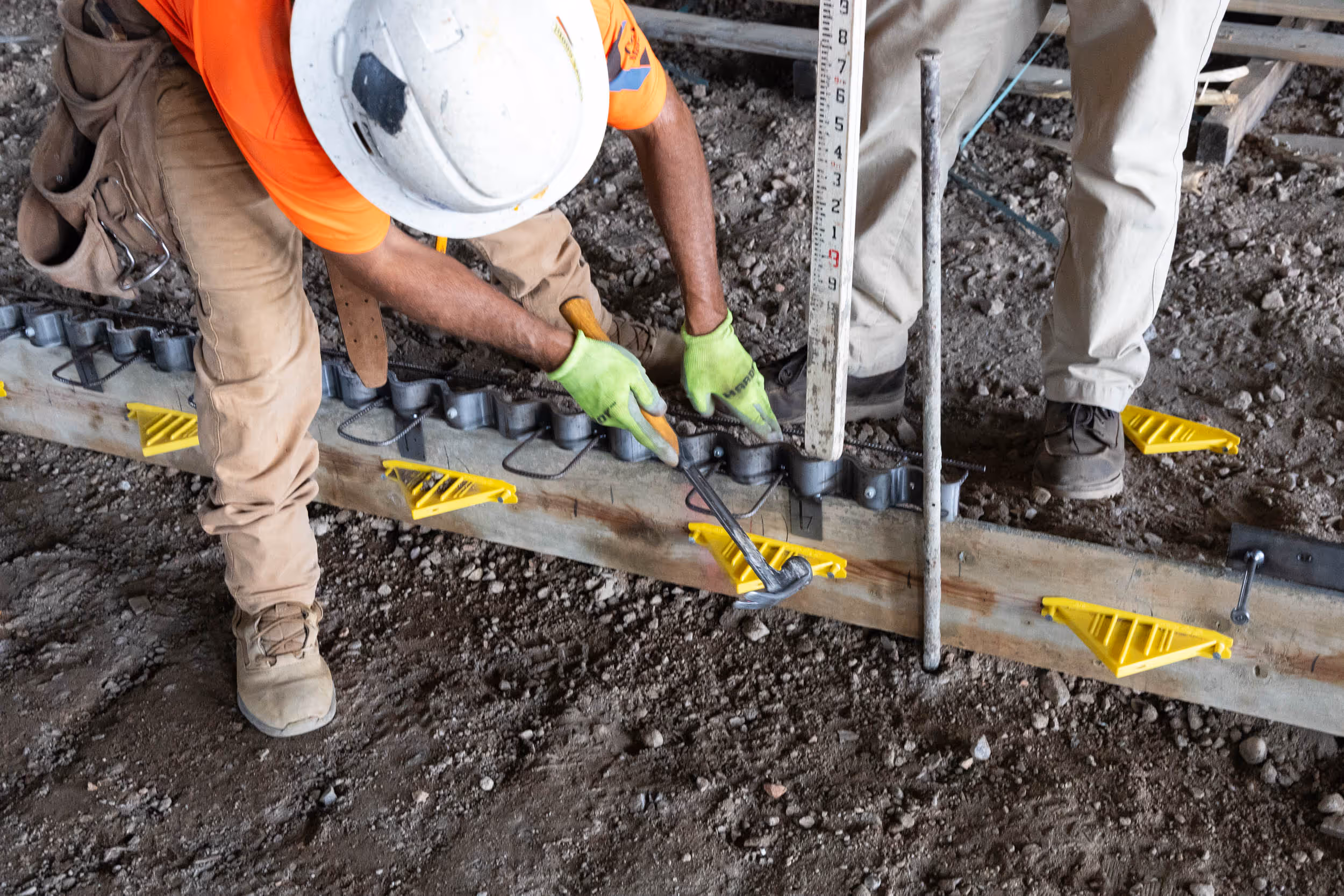 American Highway’s Serpentine™ Joint Assembly installed in warehouse concrete flatwork, ensuring shock-free load transfer and durable joints. Close-up of Serpentine™ Joint Assembly in cold storage flatwork, providing curl-free, stable concrete joints for high-traffic environments.