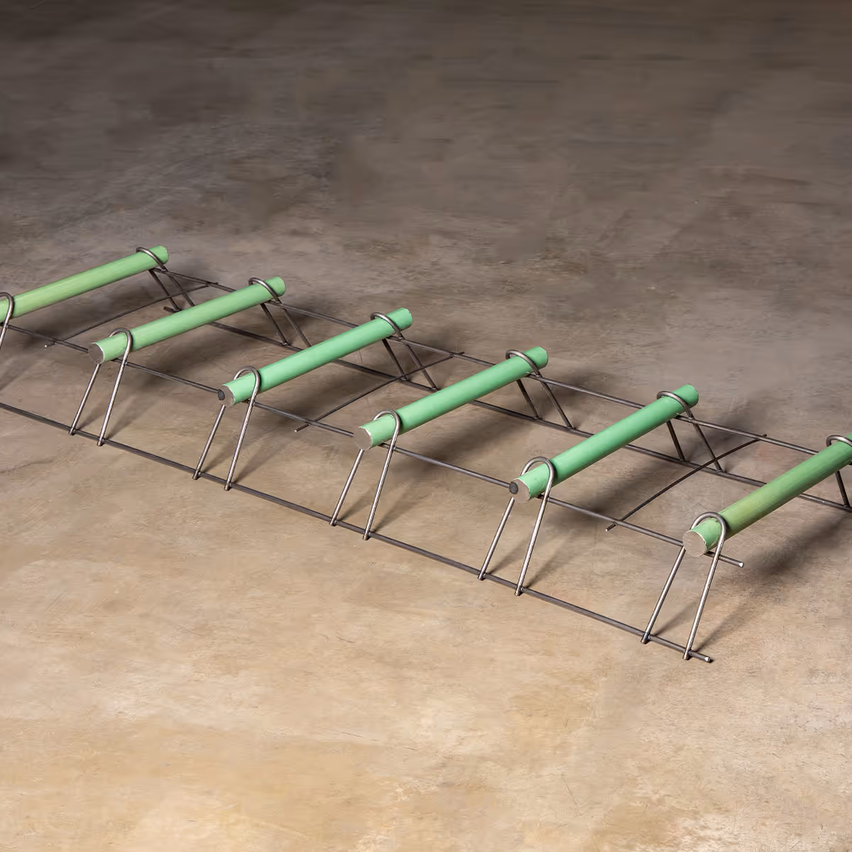 American Highway’s dowel baskets installed in warehouse concrete flatwork, ensuring stable load transfer for high-traffic joints. Close-up of American Highway’s dowel baskets in industrial flatwork, providing durable joint stability for heavy equipment loads.
