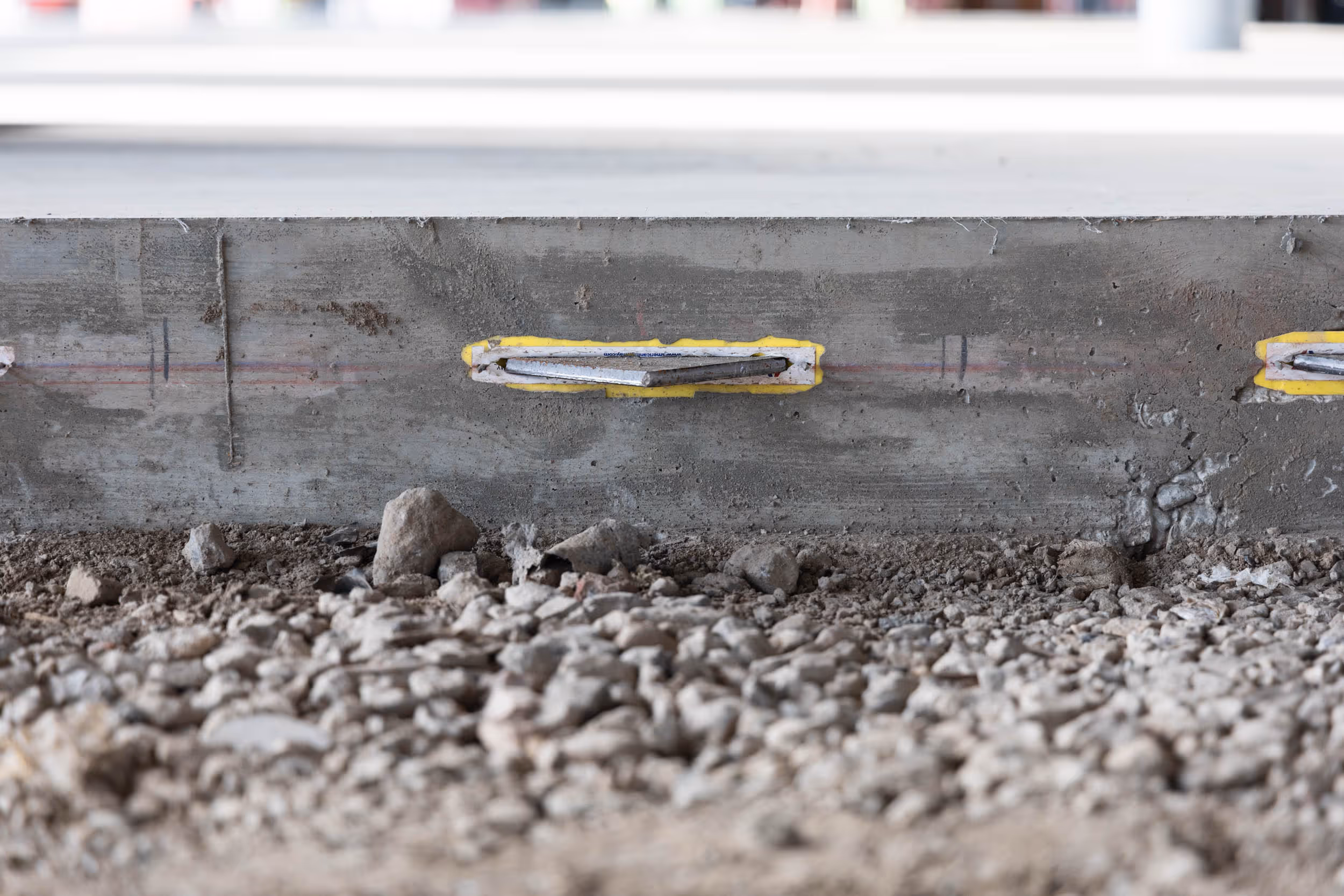 American Highway’s American Diamond™ System with diamond-shaped dowels installed in highway concrete pavement, ensuring superior joint stability. Close-up of American Diamond™ System in airport runway concrete, providing durable load transfer for high-traffic environments.