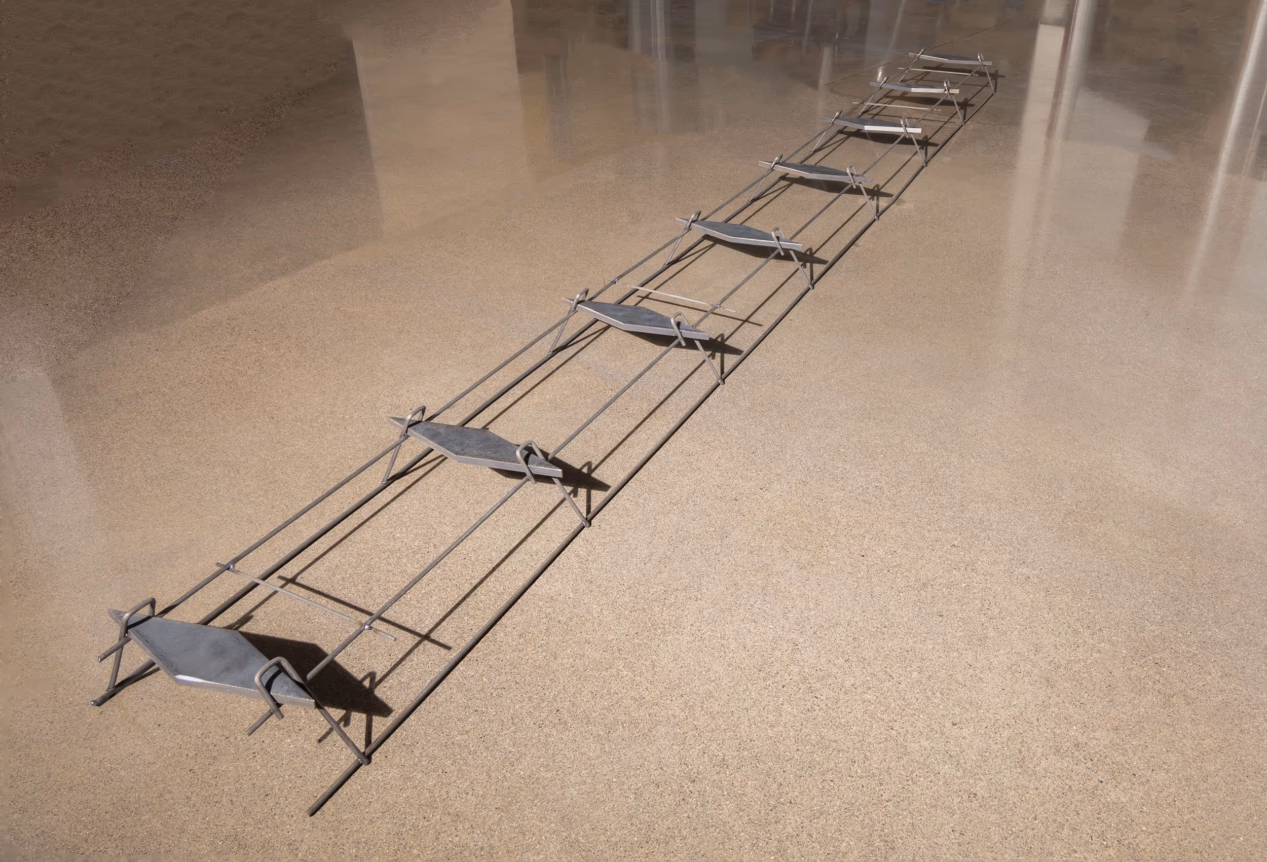 American Highway’s American DT™ Assembly with double-tapered dowels installed in warehouse concrete flatwork, ensuring precise joint stability. Close-up of American DT™ Assembly in industrial flatwork, providing robust load transfer for high-traffic concrete joints.
