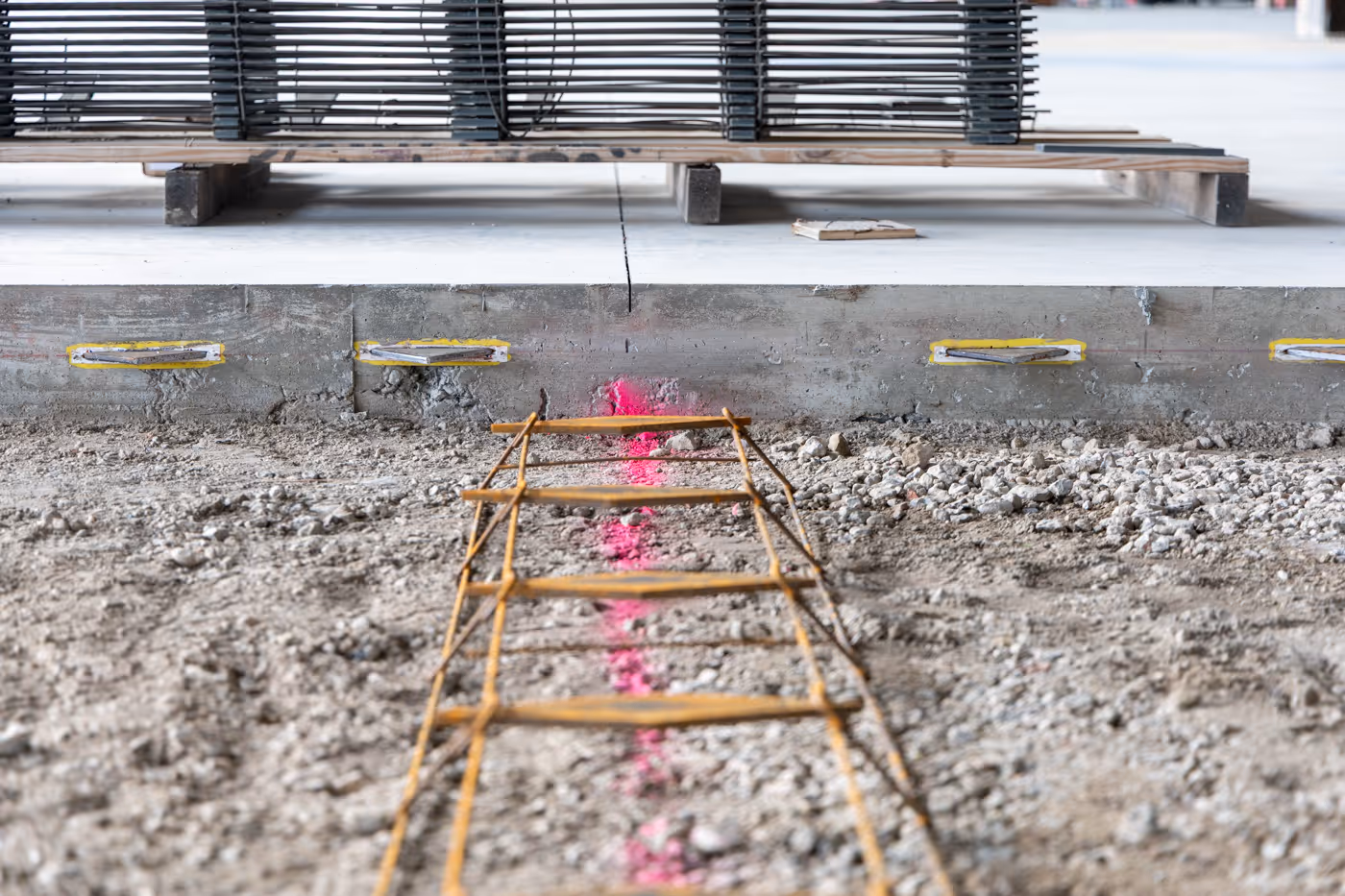 American Highway’s American DT™ Assembly with double-tapered dowels installed in warehouse concrete flatwork, ensuring precise joint stability. Close-up of American DT™ Assembly in industrial flatwork, providing robust load transfer for high-traffic concrete joints.
