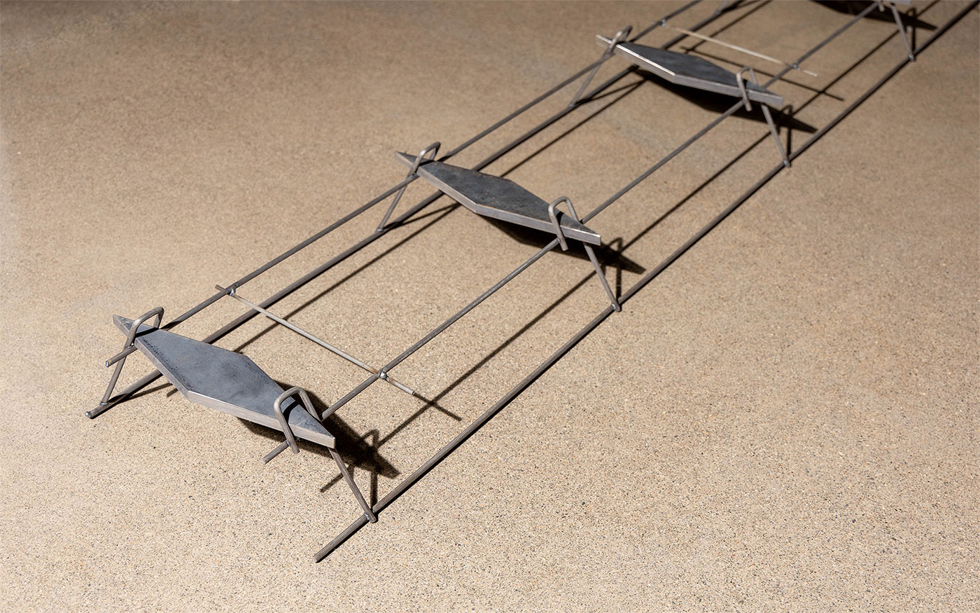 American Highway’s American DT™ Assembly with double-tapered dowels installed in warehouse concrete flatwork, ensuring precise joint stability. Close-up of American DT™ Assembly in industrial flatwork, providing robust load transfer for high-traffic concrete joints.