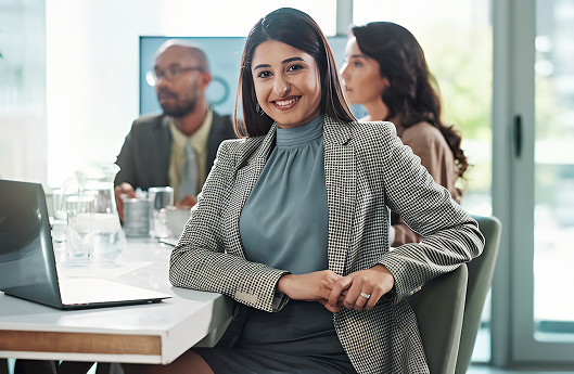 Professional woman smiling in a business meeting