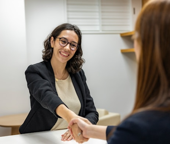 Woman smiling in a business setting