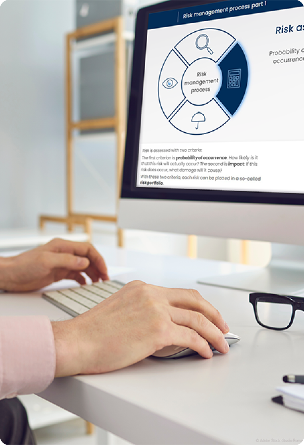 Hands infront of a screen clicking through E-Learning