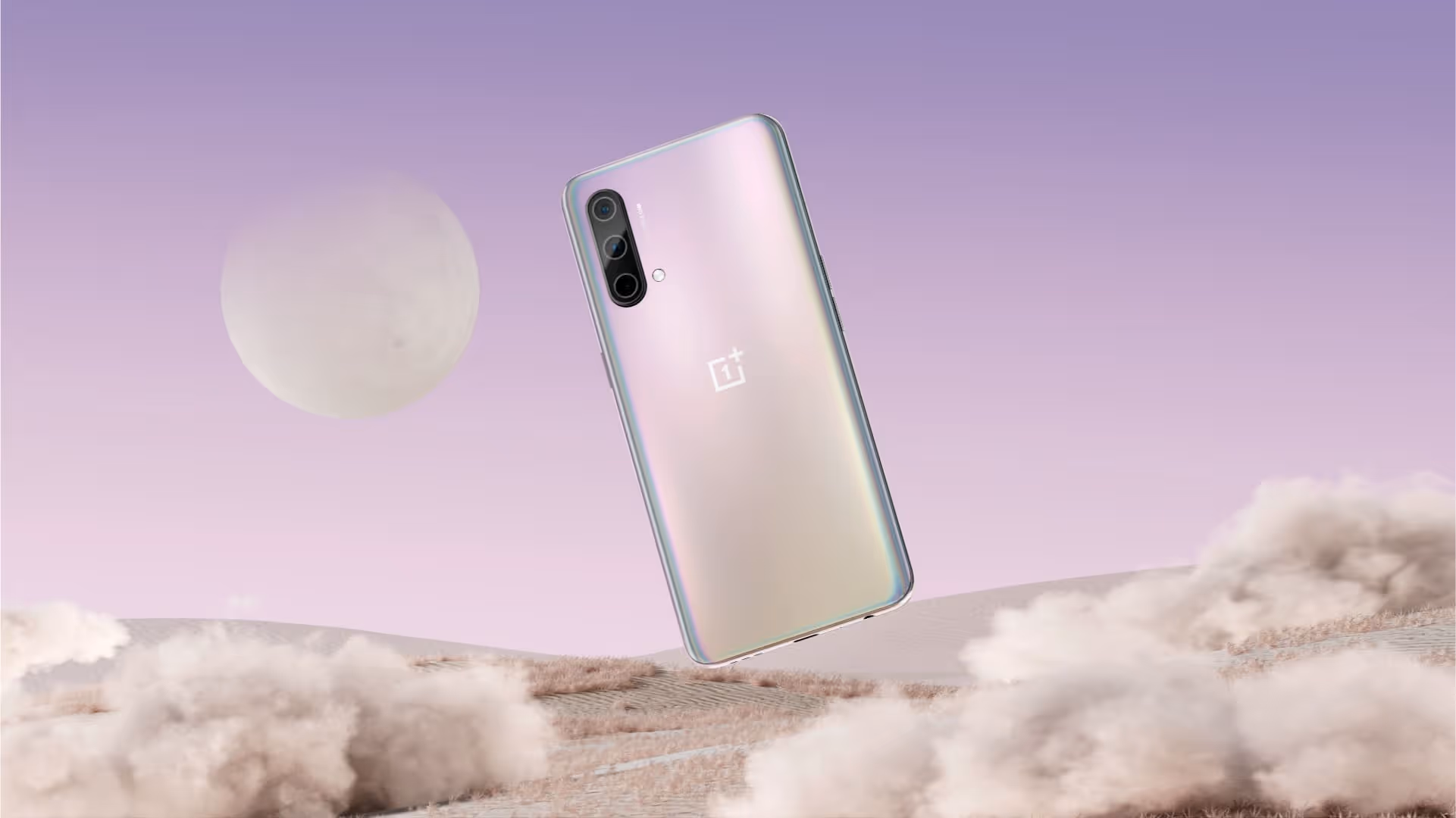 OnePlus device stands on landscape with moon in the top left of the background.