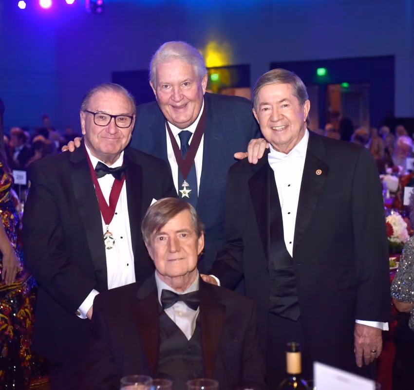 Four gentlemen in tuxedos, two of whom are wearing Medallions, pose together for a photo prior to the Induction Ceremony. In photo are Bob Burke, Mike Turpen, Drew Edmondson & Jim Edmondson.