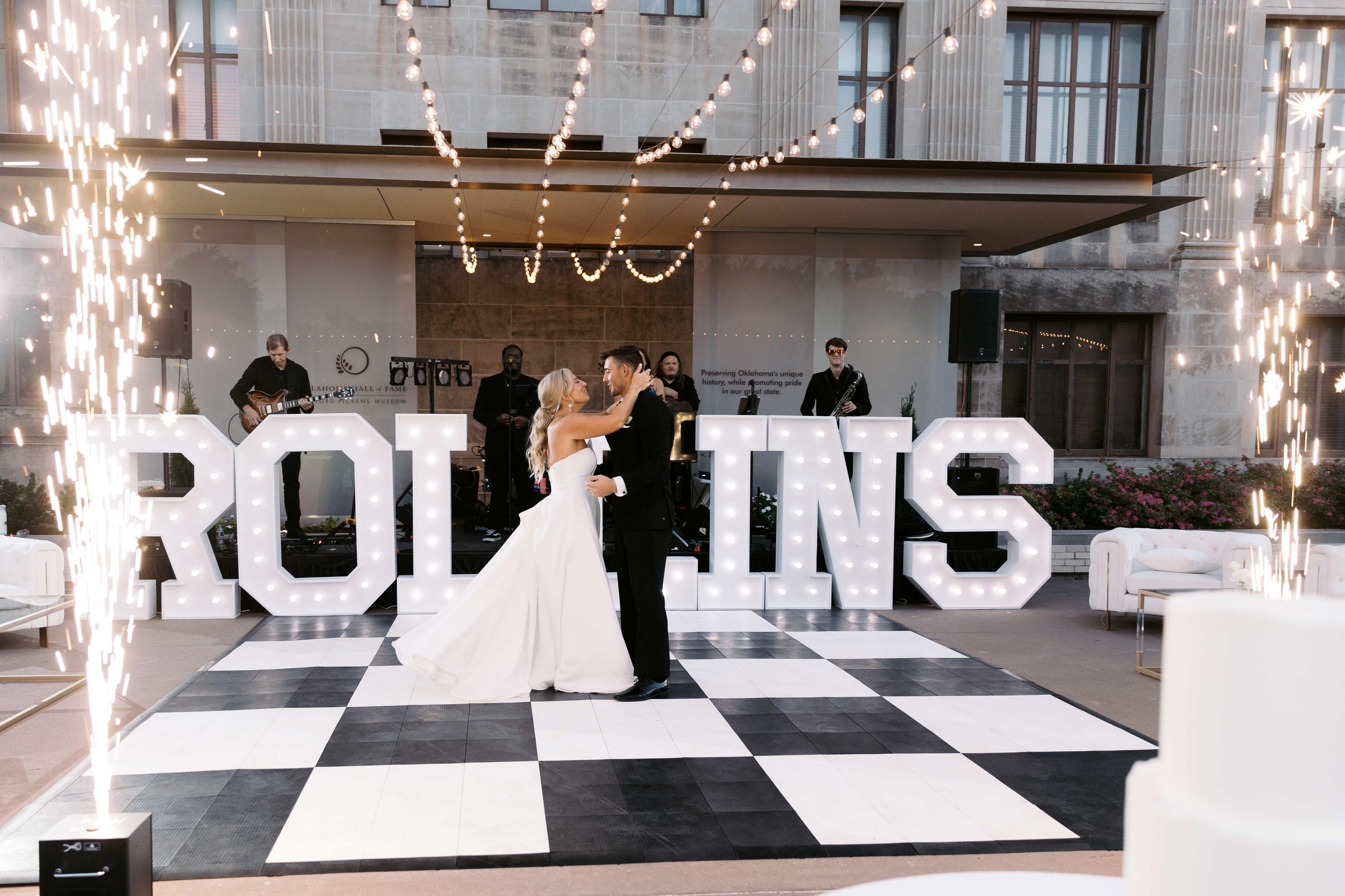 A bride and groom dance in the Oklahoma Hall of Fame garden.