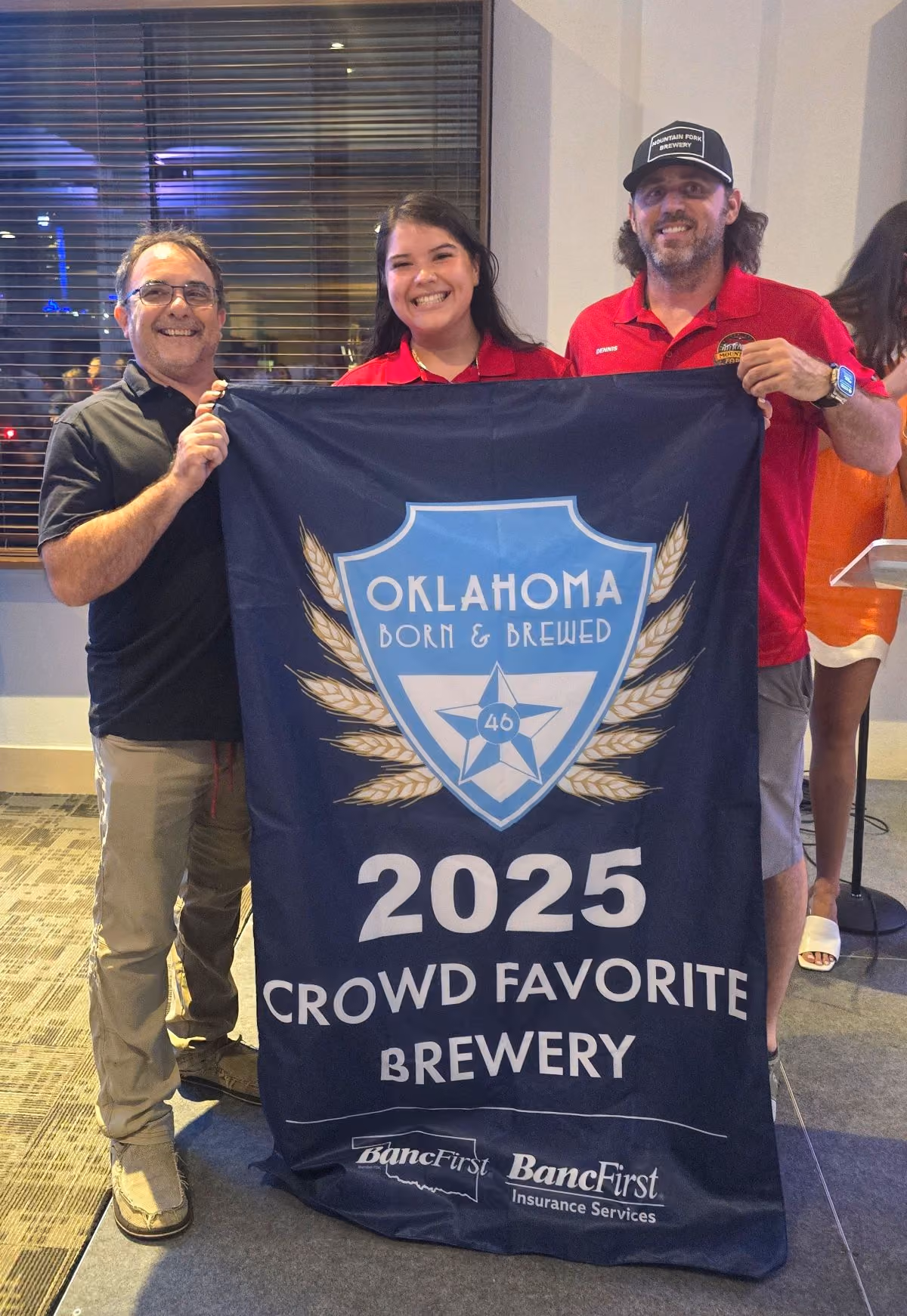 Mountain Fork Brewery holds up their Crowd Favorite Brewery banner.