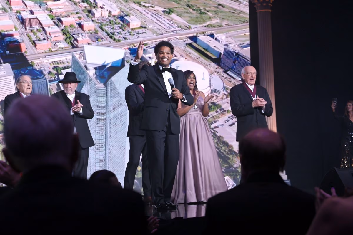 Tony Mason, the 2025 Ambassador of Goodwill, sings on stage.