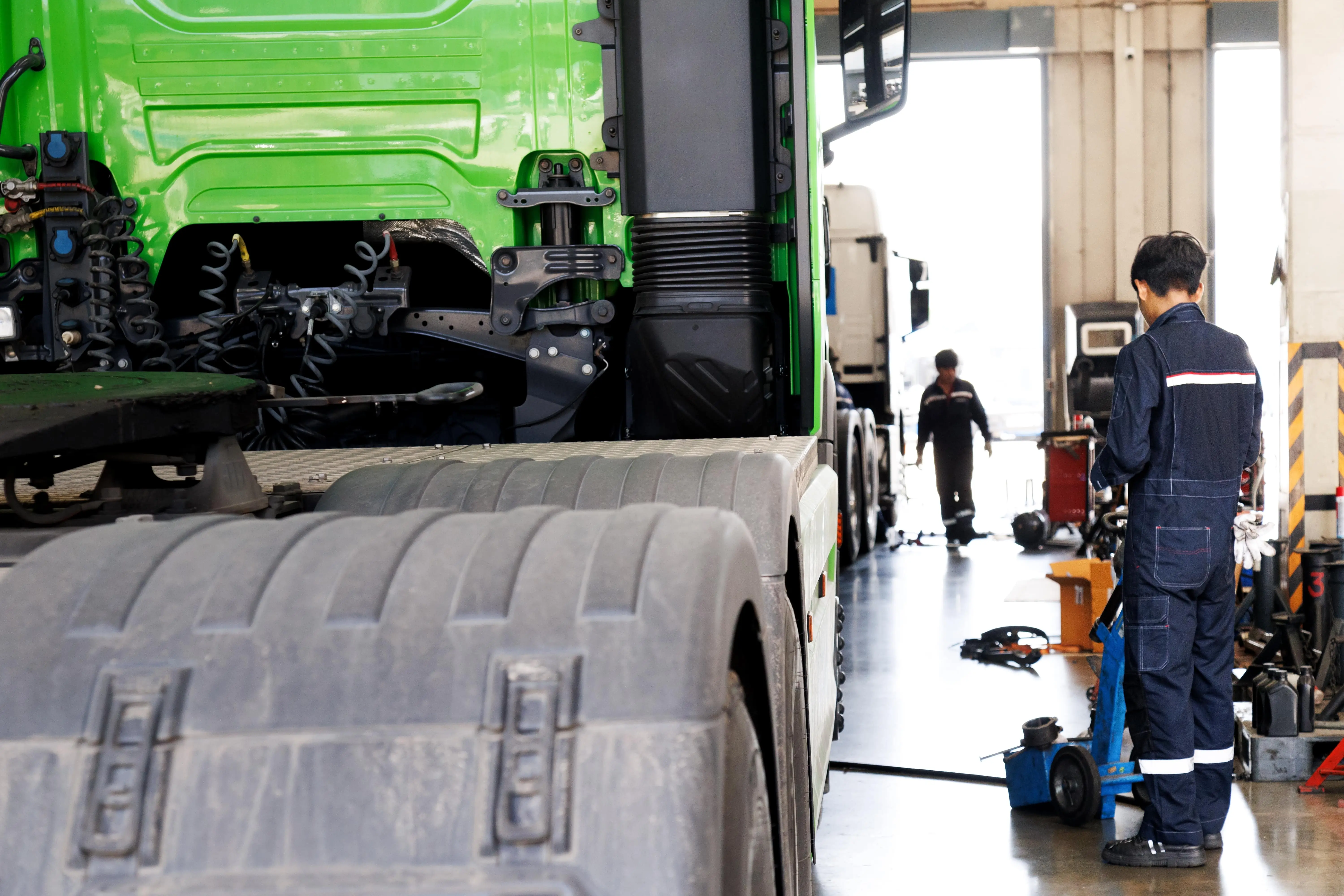 Heavy-duty truck brake system being inspected by mechanic in Edmonton