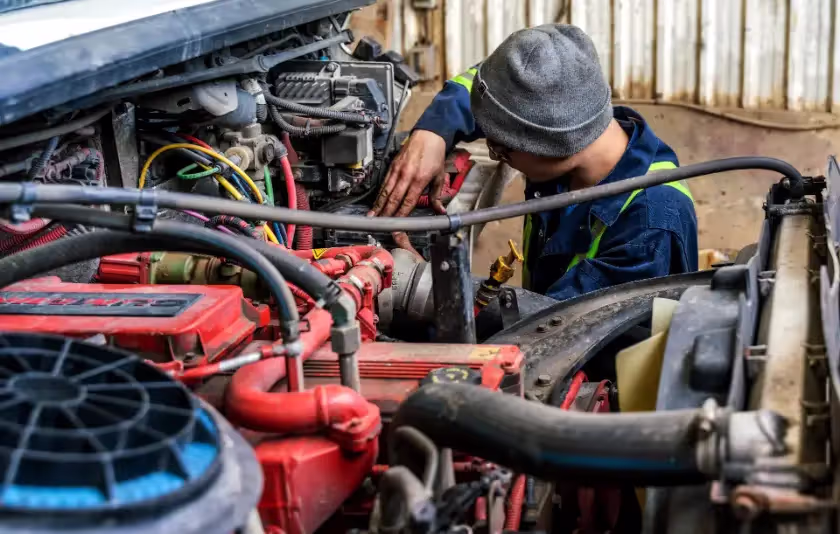 Diesel mechanic performing general diesel repairs on semi truck in Edmonton, Alberta