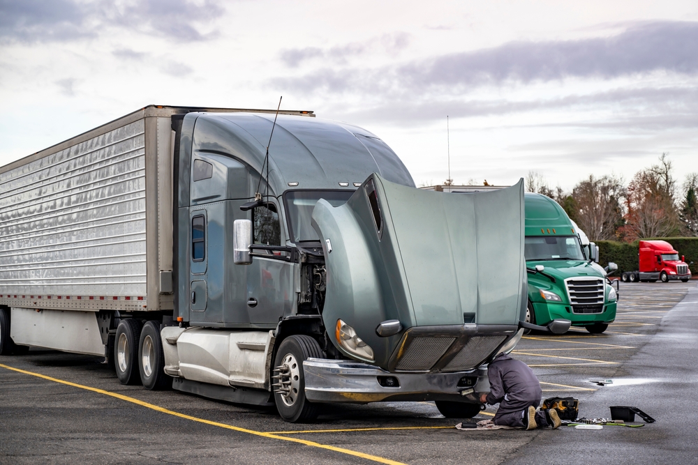 Heavy-duty fleet truck undergoing summer maintenance inspection in Edmonton, Alberta