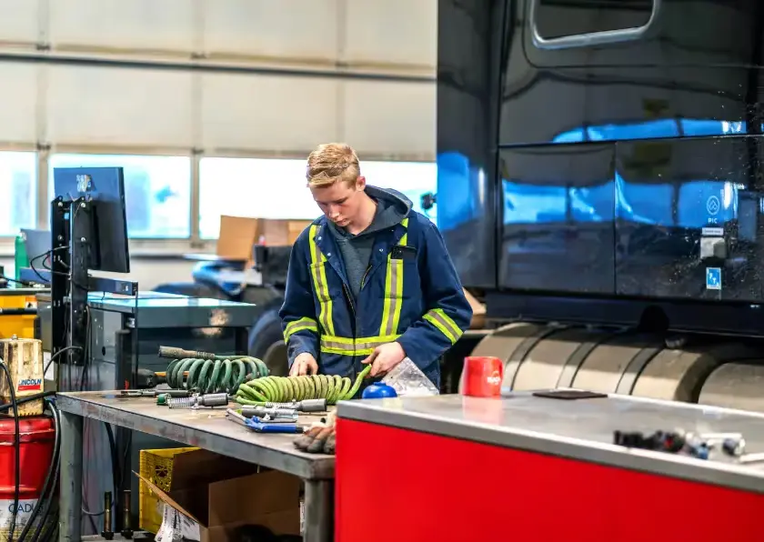 Diesel mechanic performing heavy equipment repair in Edmonton, Alberta