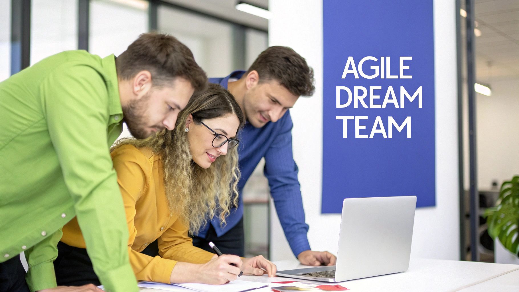A diverse group of software developers collaborating around a table with laptops and sticky notes, illustrating an agile team meeting.