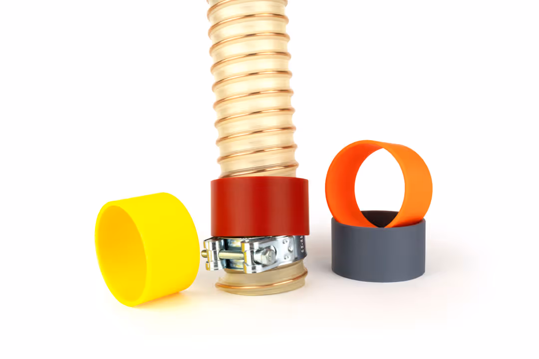 Farbige Schlauchringe in gelb, dunkelrot, dunkelgrau und orange zur farblichen Markierung von Schläuchen.