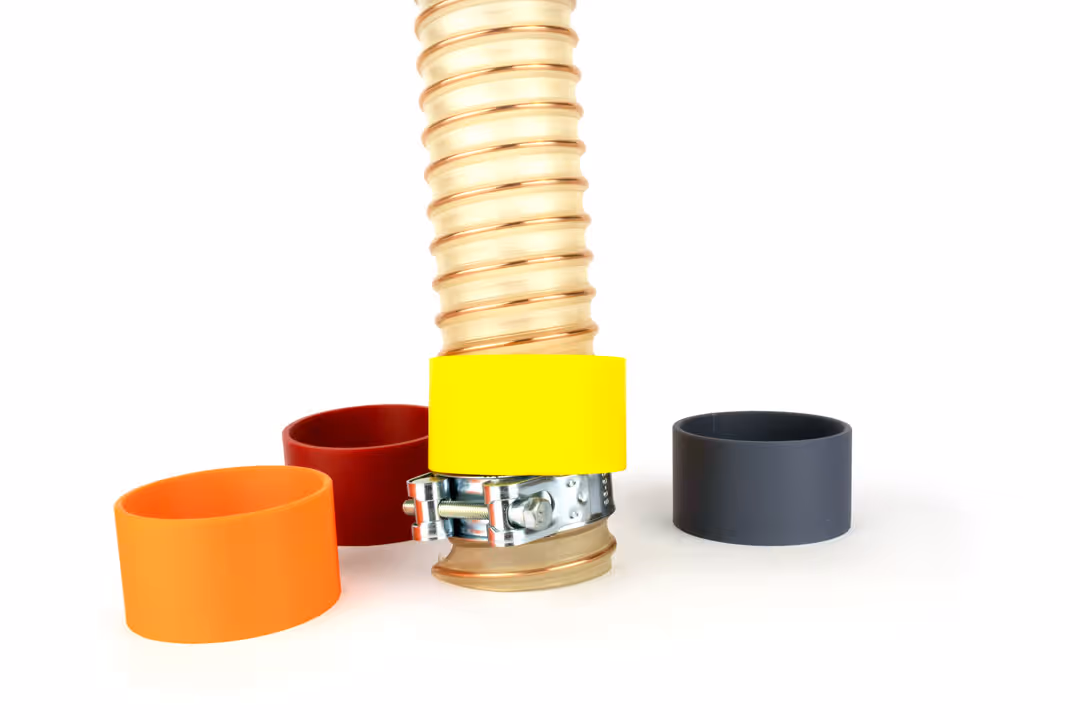 Farbige Schlauchringe in orange, dunkelrot, gelb und dunkelgrau zur farblichen Markierung von Schläuchen.