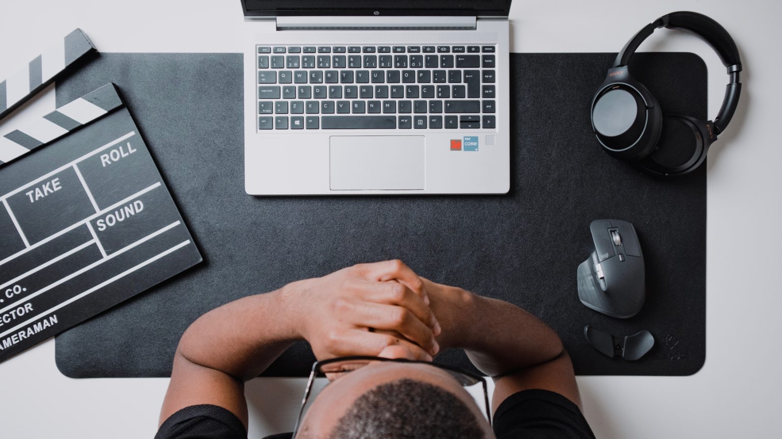 Frustrated real estate investor with head in hands at a desk, showing common investing mistakes