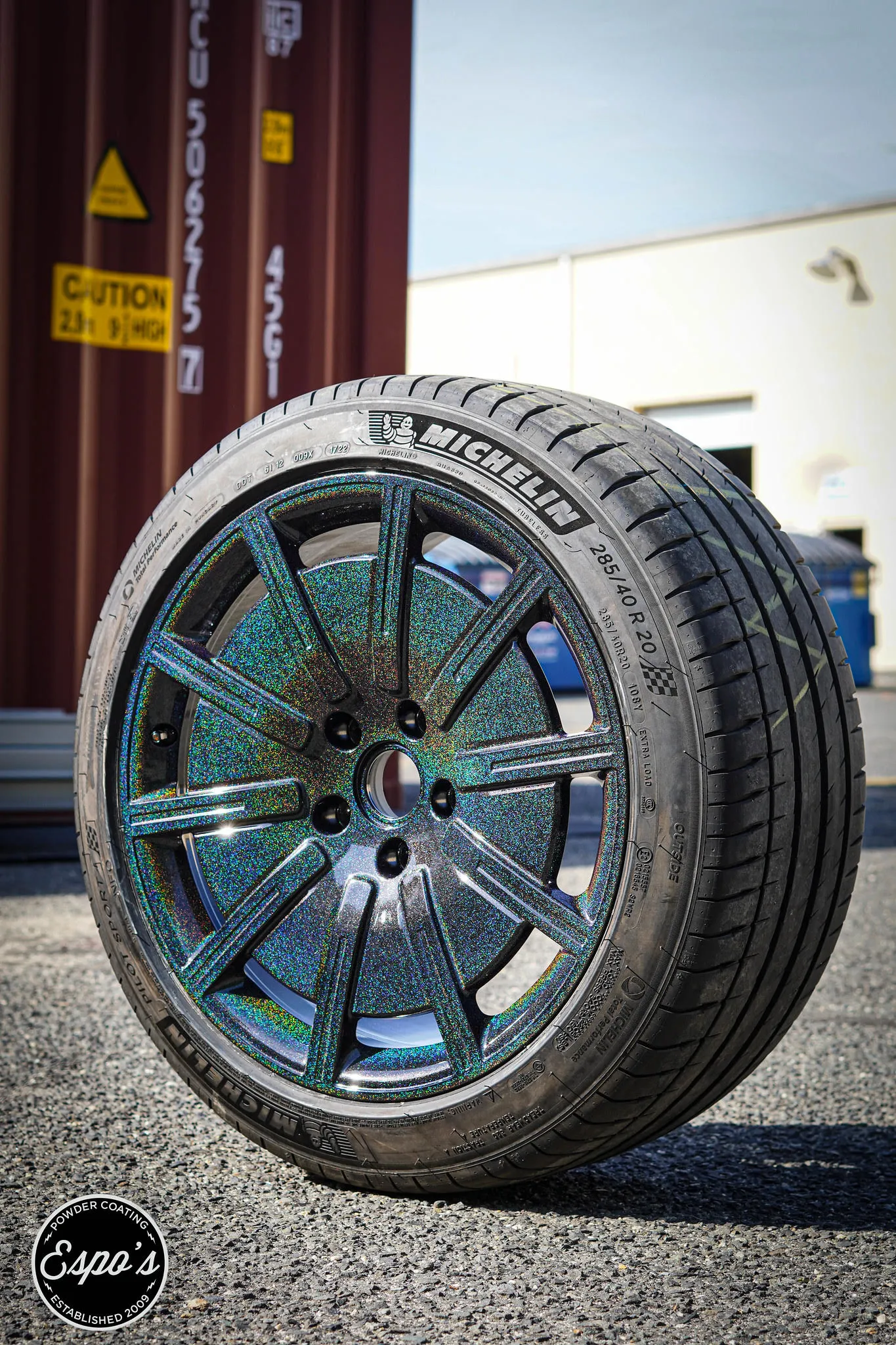Color shift powder coated wheel with a new tire, wheel powder coating in NJ