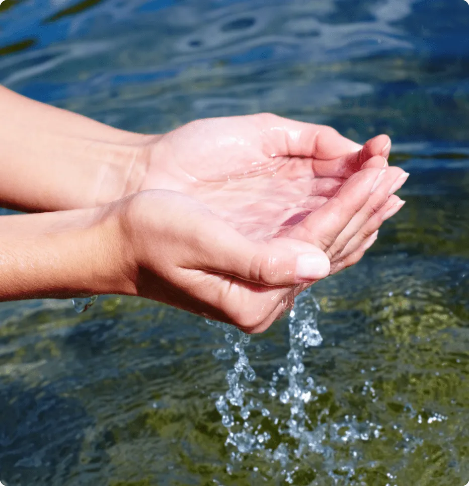Hands scooping up clean water