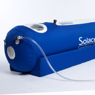 Blue cylindrical hyperbaric oxygen chamber with clear tubing attached, labeled 'Solace'.