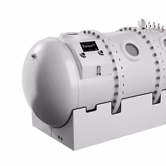 White cylindrical industrial machine with multiple bolts and control panels branded with 'Fortius'.