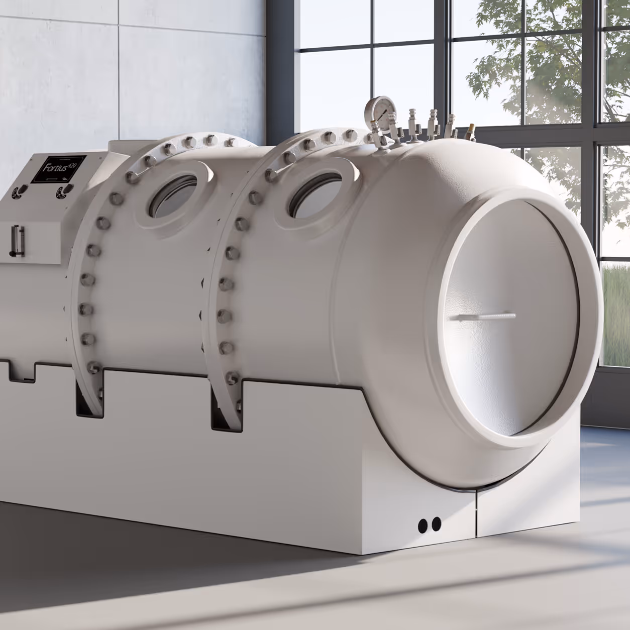 Modern hyperbaric oxygen therapy chamber labeled Fortius 420 in a sunlit room with large windows.