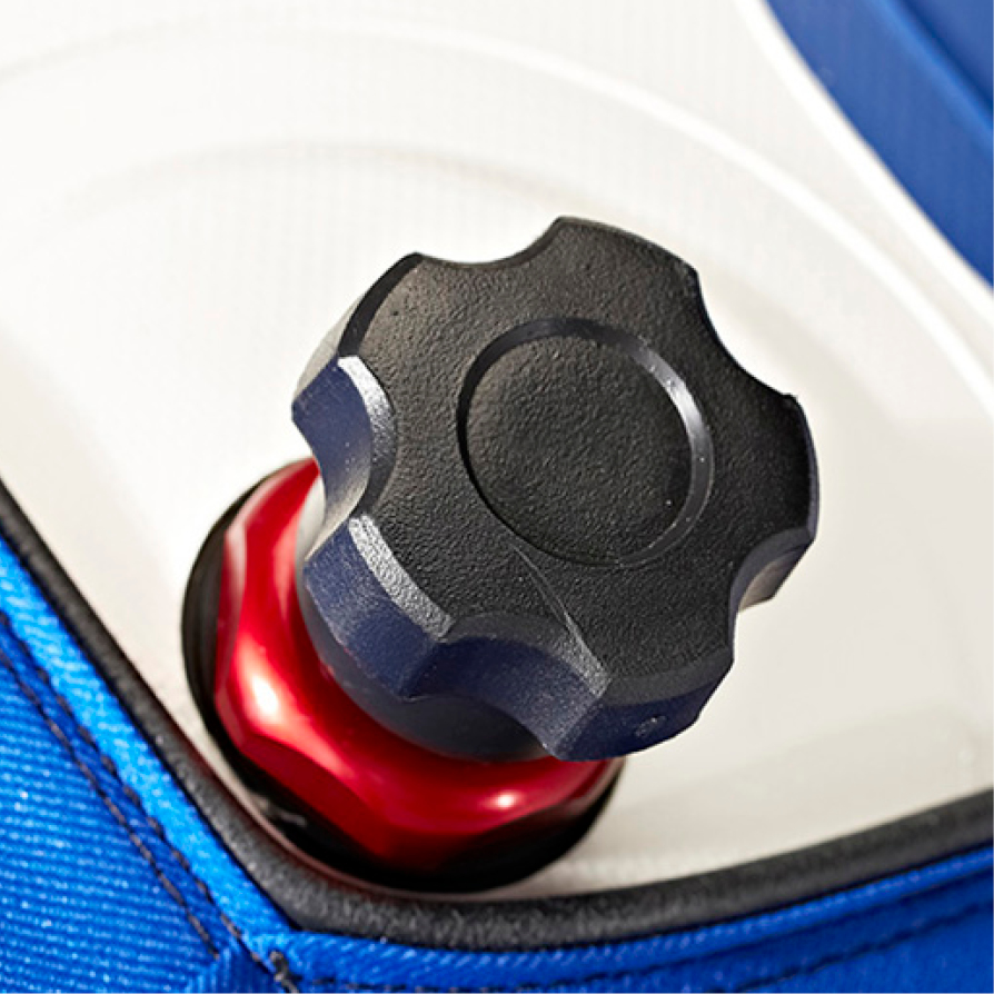 Close-up of a black plastic knob with a red metal base on a white and blue background.
