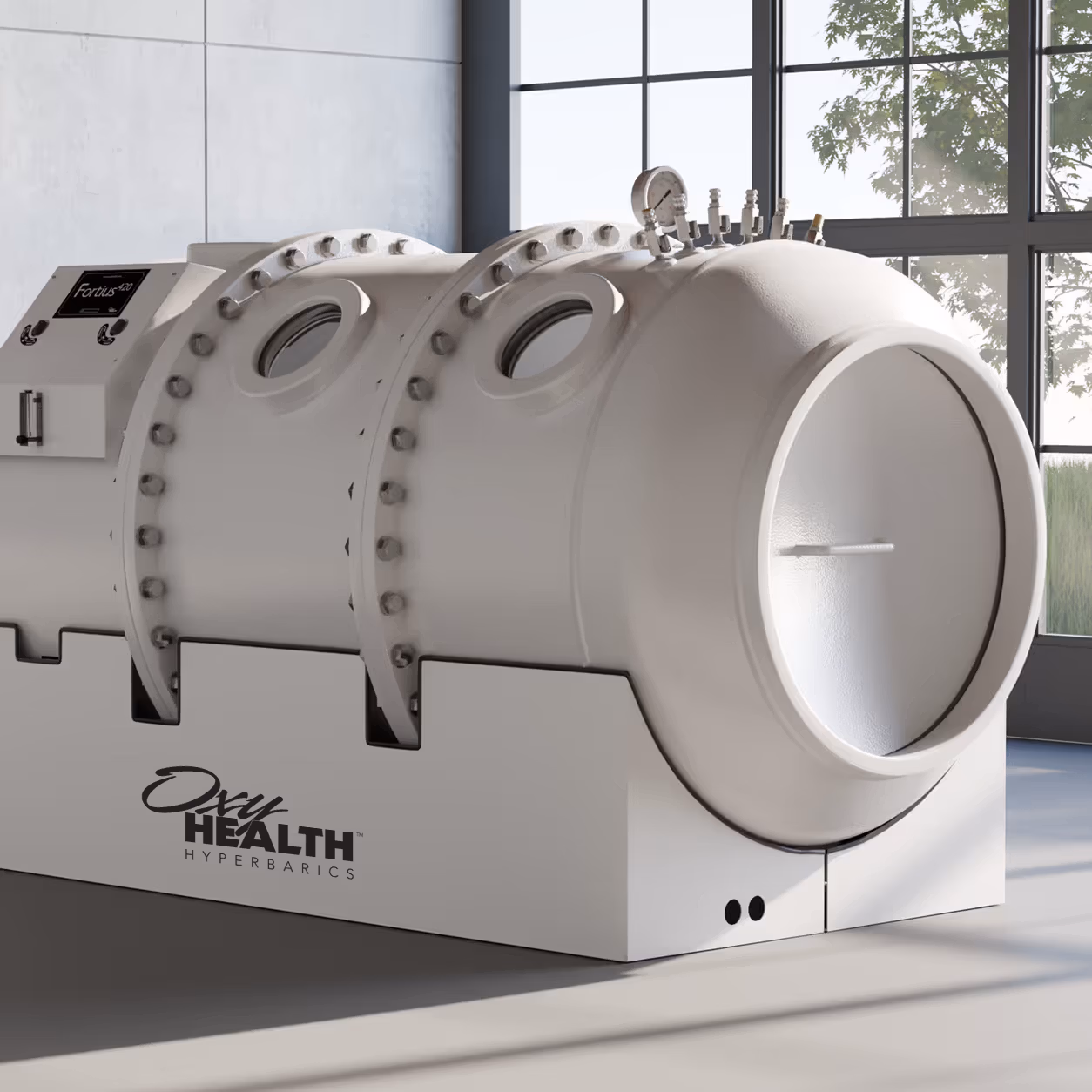 Modern hyperbaric oxygen therapy chamber labeled Fortius 420 in a sunlit room with large windows.
