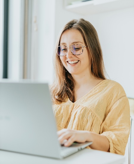 woman on computer; best therapists Denver Colorado