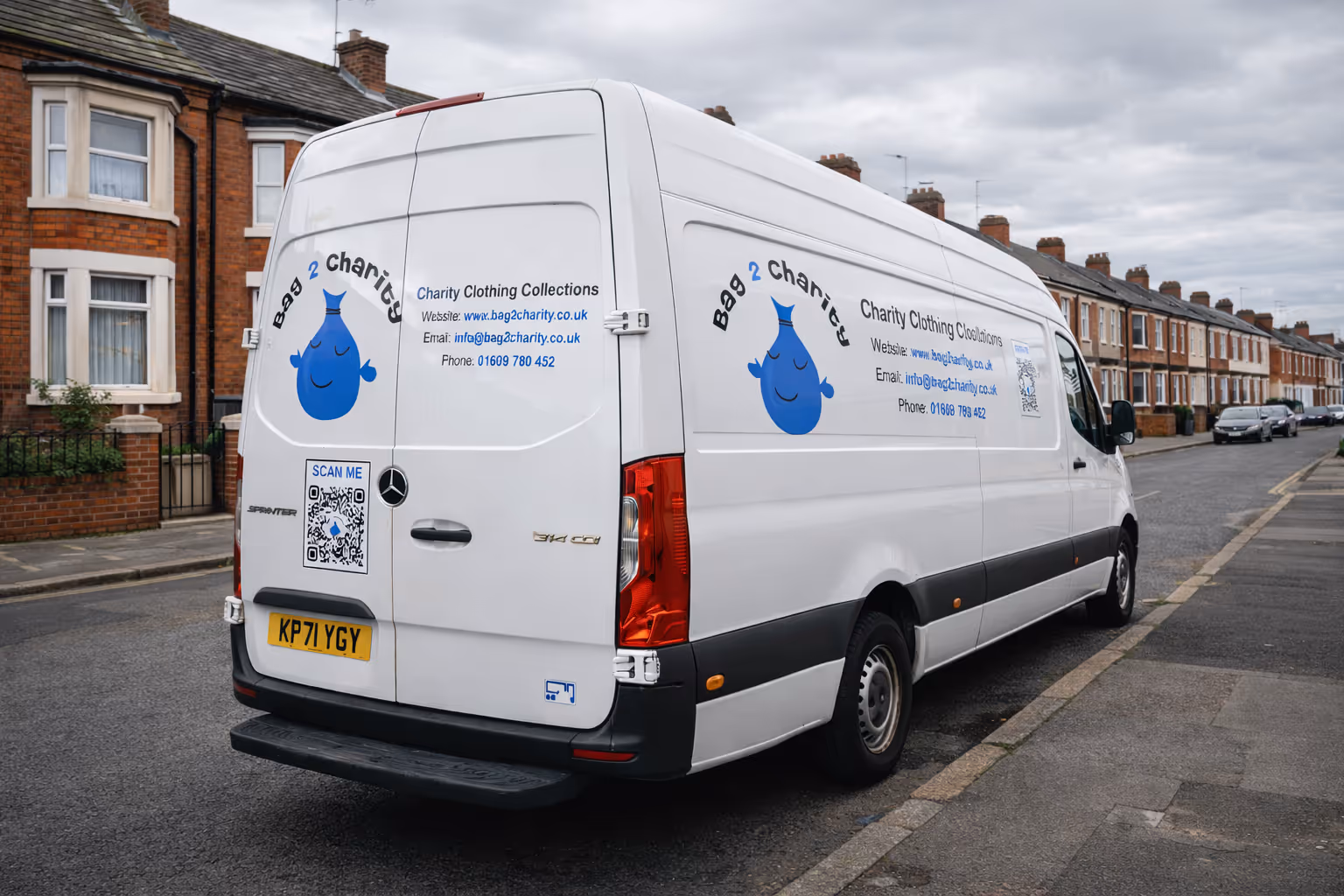A white Mercedes Sprinter van parked on a residential street in Manchester, England.