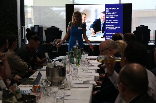 Business seminar in Australia: presenter, audience, boardroom table.