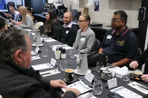 People at a business breakfast event in Australia.
