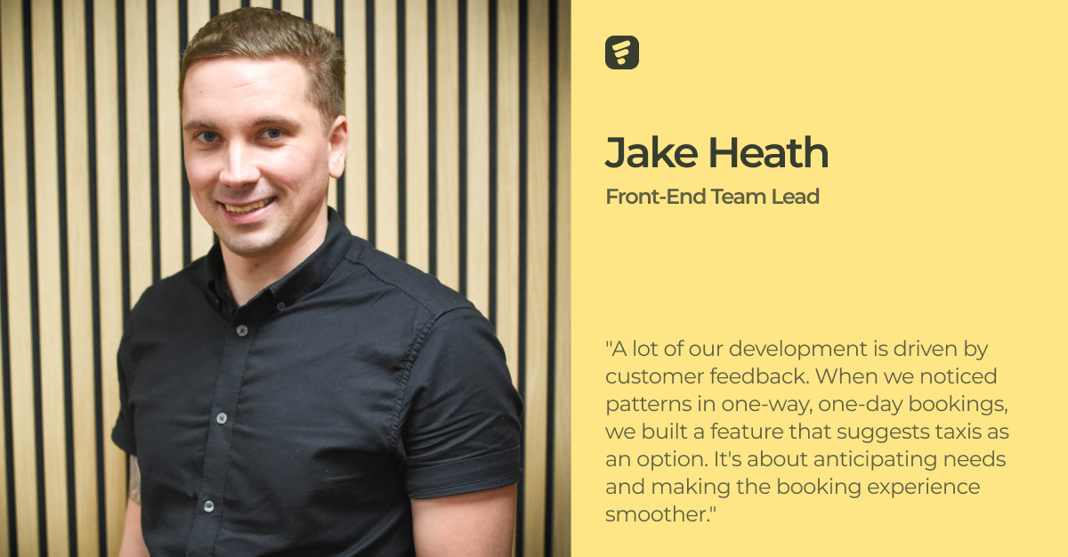 Man with blonde hair sits in front of panelled wall with writing 'Jake Heath, Front End Team Lead'.