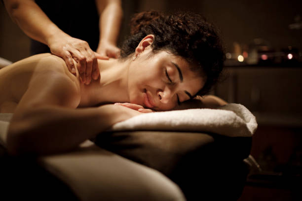 Beautiful woman enjoying in massage Beautiful woman enjoying in massage Massage services stock pictures, royalty-free photos & images
