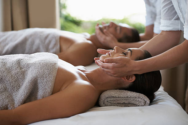 Miracle inducing hands Shot of a mature couple enjoying a relaxing massage massage stock pictures, royalty-free photos & images