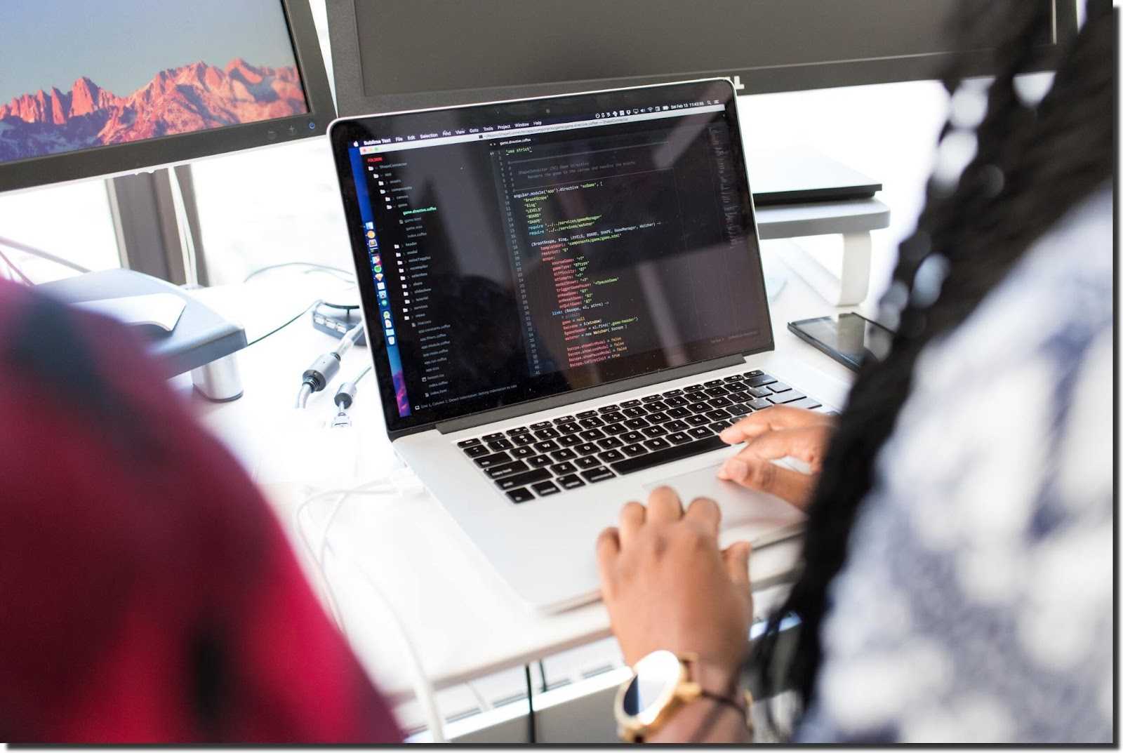 woman-working-on-Macbook-Pro