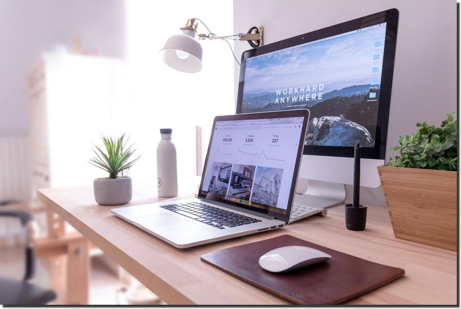 Macbook-Pro-on-bedside-table-with-white-iMac-and-magic-mouse