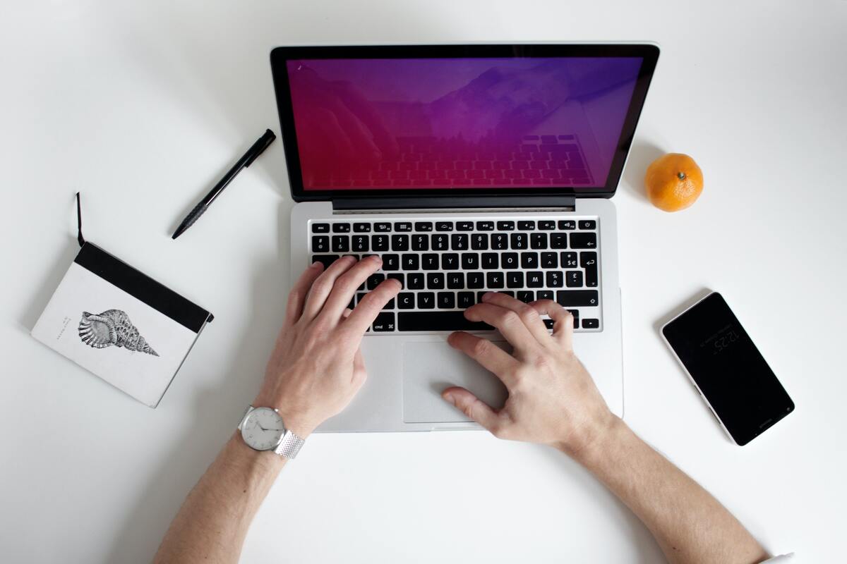 person-typing-on-laptop-on-table