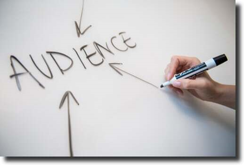 word - audience, written by marker in desk
