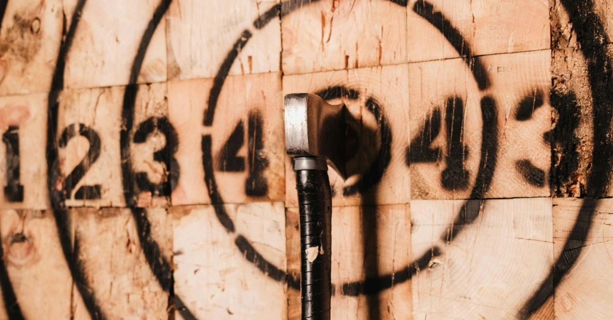 Axe locks into a bullseye on a wooden target at Axe Throwing in Melbourne CBD