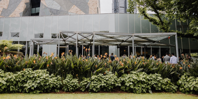 A group of delegates gather in the garden space at Zinc at Federation Square.