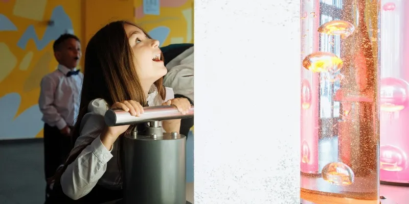 Girl interacting with a science exhibit in a museum