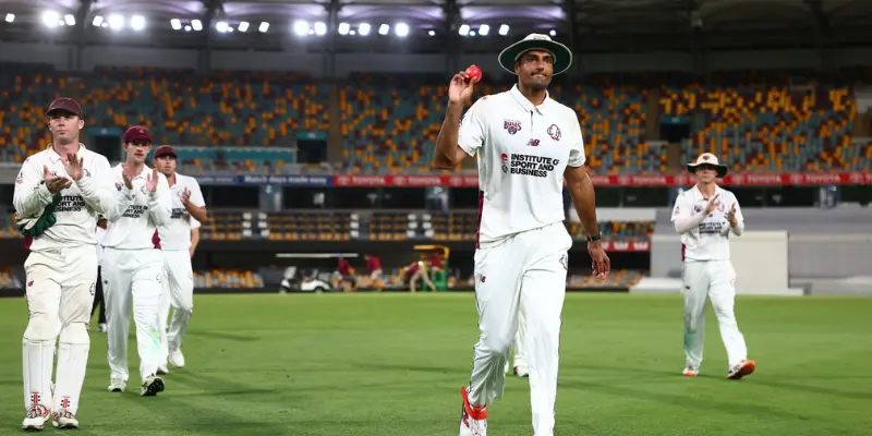 Queensland player celebrating five-wicket haul at the Gabba
