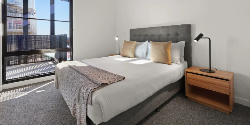 Modern bedroom with a large window at Solarino House