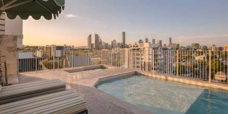 Rooftop magnesium pool with Brisbane skyline views at Rambla Story House Kangaroo Point