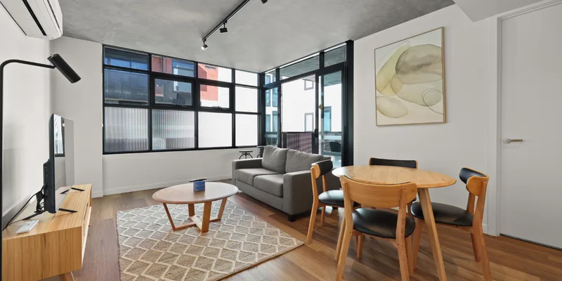 Open plan living and dining area in a Rambla @ Solarino House apartment in Brunswick