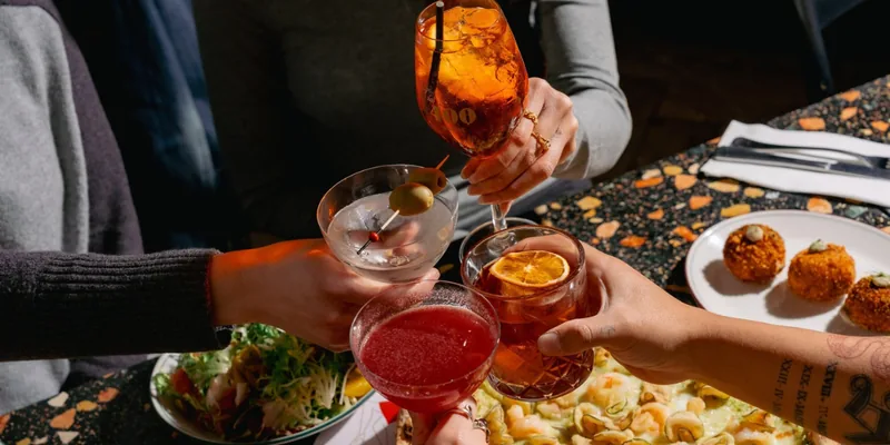 Cocktails clinked over pizza and arancini at 400 Gradi, Brunswick East