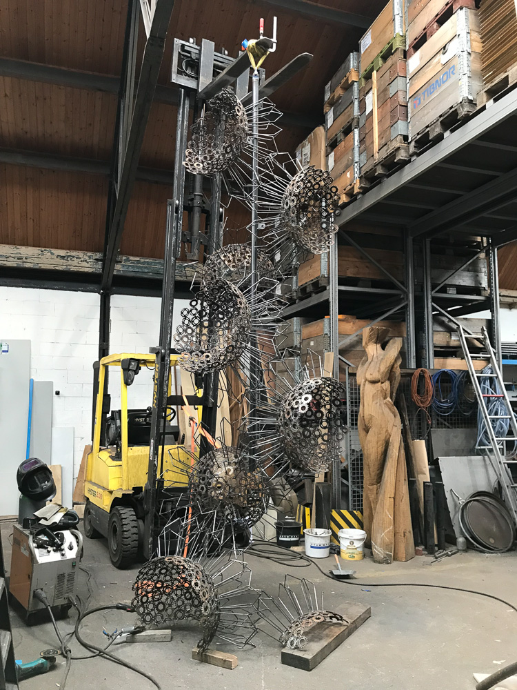 Creative process photo of sculpture Matter of Life by Marisja Smit. Welded out of repurposed steel gears. 